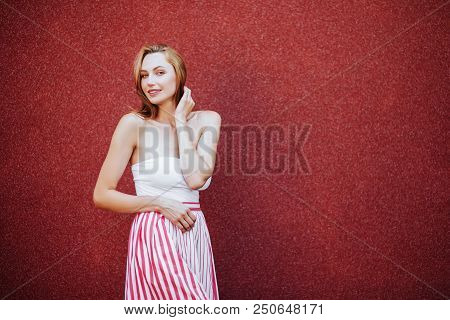 Portrait Of Beautiful Woman In Red Dress, Smiling. Casual Lifestyle Photo.