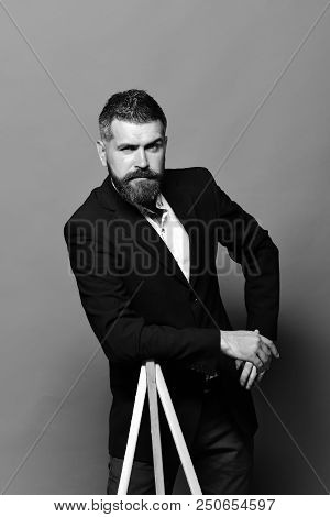 Art And Style Concept. Man With Beard And Moustache Wearing Classic Suit. Artist With Stylish Hairdo