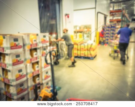 Customer Shopping In Wholesale Store Near Cold Storage Room