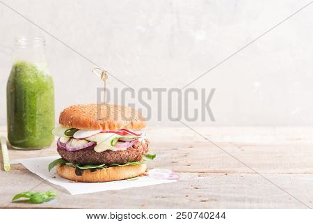 Veggie Bean And Quinoa Burger With Fresh Vegetables. Copy Space