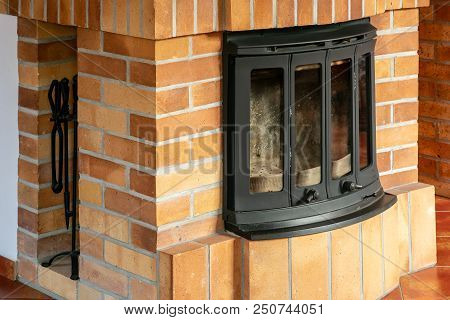 Fireplace, Detail Of Home Interior. Fireplace Covered With Fireclay Bricks.