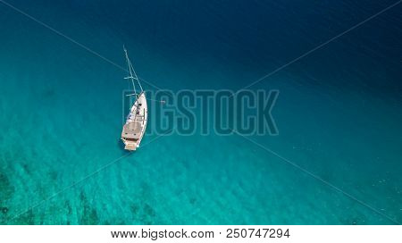 Sailing boat on open water, aerial view. Active life style, water transportation and marine sport.