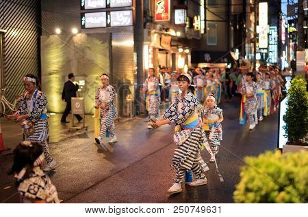 Osaka, Japan - July 23, 2018: Young Women Perform Traditional Dance In Street During Summer Festival