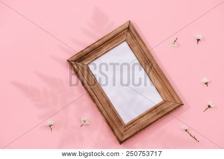 Wooden Frame Mockup With Fallen Flowers In The Background