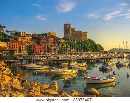 San Giorgio Castle Of Lerici Town From The Of Gulf Of Poets With Sailing Boats And Motor Boats At Su