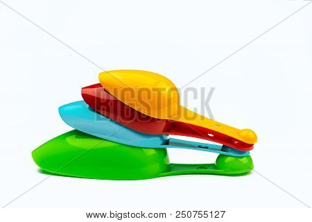 Set Of Colorful Plastic Measuring Spoon Isolated On White Background With Shadow. Green, Blue, Red, 