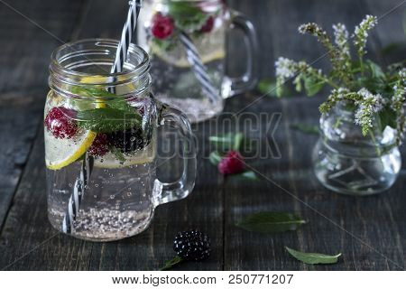 A Cooling Lemon Drink In A Glass Cup On A Wooden Table