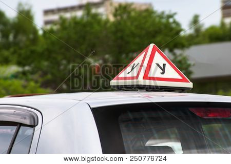 Russian Driving School Sign On Car Roof