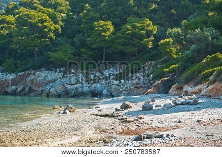 Sea Rocks At Calm And Crystal Clear Turquoise Water At Morning, Milia Beach, Island Of Skopelos, Gre