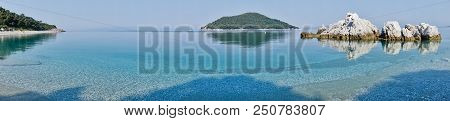 Sea Rocks At Calm And Crystal Clear Turquoise Water At Morning, Milia Beach, Island Of Skopelos, Gre