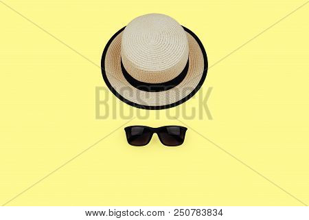 Sunprotection Objects Sunglasses And Hat On Yellow Background. Lay Flat. Top View.