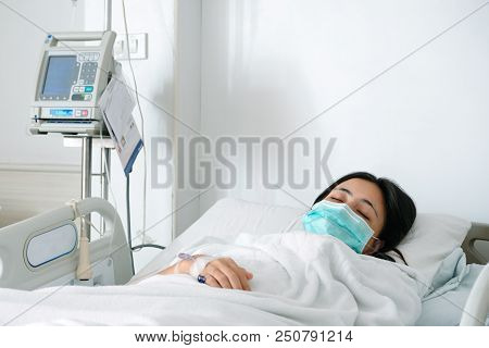 Close Up Young Woman Patient Lay On Bed In Hospital With Intravenous Normal Saline