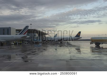 Passenger Planes Prepare For A Departure At The Terminal.