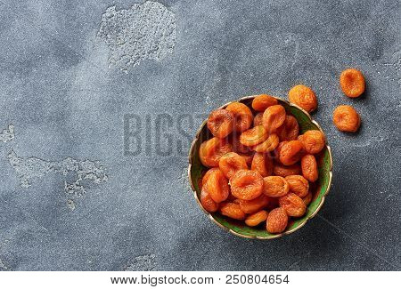 Dried Apricots On Gray Background. Witn Copy Space. Top View.
