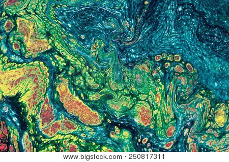 Marbling Textured Creative Background. Mixing Green, Yellow, Blue And Red Paints.  Handmade Surface.