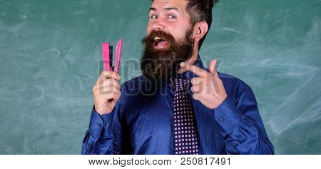 Teacher Bearded Man With Stapler Chalkboard Background. Prepare For School Season Buy Stationery. Ma