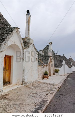 Unique Small South Italia City Alberobello With Antient Stones Conical Houses Trullo, Tourist Destin