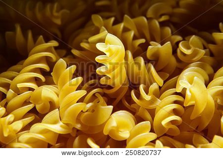 Raw Uncooked Dry Italian Fusilli Pasta. Corkscrew Spiral Shape