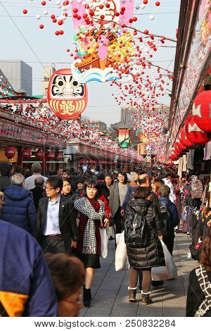 Tokyo, Japan - December 4, 2016: People Visit Nakamise Souvenir Shop Street Of Asakusa In Tokyo, Jap
