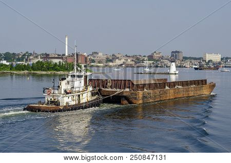 New Bedford, Massachusetts, Usa - July 2, 2018: Tug Sirius Pushing Empty Barge Past Palmer Island Li