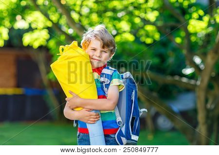 Happy Little Kid Boy In Colorful Shirt And Backpack Or Satchel And Traditional German School Bag Con