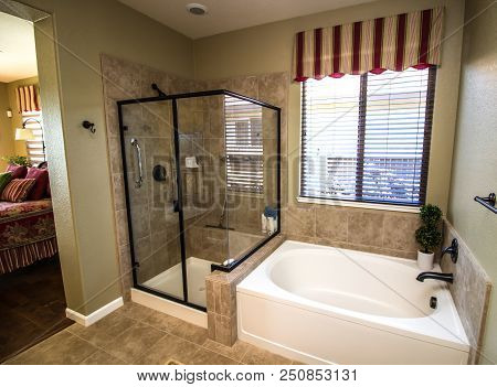 Modern Bathroom With Glass Shower And Bathtub