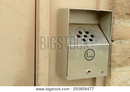 Closeup Image Of An Exterior Wall Mounted Smokers Butt Ashtray For Smutting Out Cigarettes Before En
