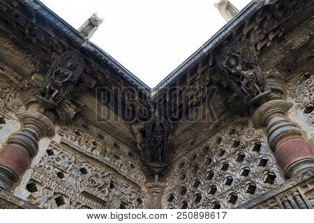 Ornate Perforated Window And Madanikas, Salabhanjika Meaning Celestial Damsels, On Top Of The Pillar
