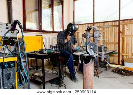 Industrial Vise Tool In Workshop For Support Hard Work. Tool For Metalworking, Fixing And Squeezing