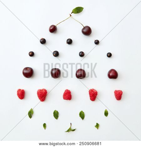 Colorful pattern of natural fresh ripe berries isolated on white background,