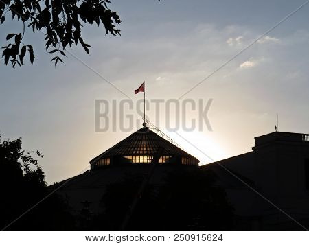 Sun Sunset Over Polish Senate And Parliament Building, Warsaw, Poland