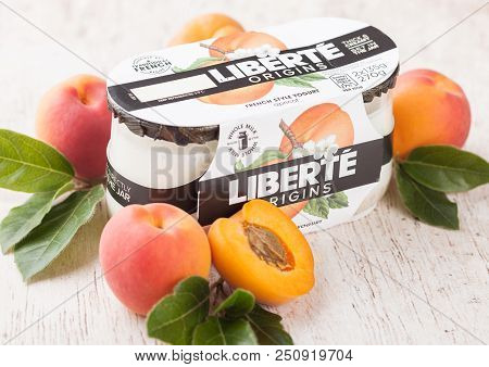 London, Uk - July 28, 2018: Pack Of Liberte Origins French Style Yogurt With Apricot Flavour On Wood