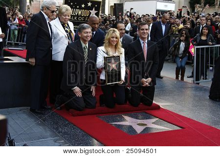 LOS ANGELES - NOV 8: Shakira with her parents and Leron Gubler, Eric Garcetti as she receives a star on the Hollywood Walk of Fame outside the W Hotel in Los Angeles, California on November 8, 2011