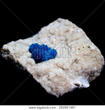 Natural Cluster Blue Cavansite On The Substrate On A Black Background