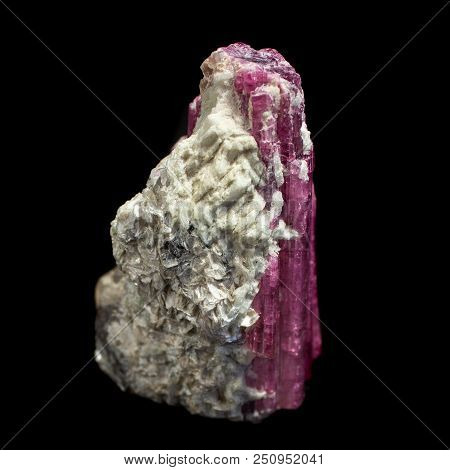 Natural Mineral Elbaite Tourmaline Natural Cut On A Black Background