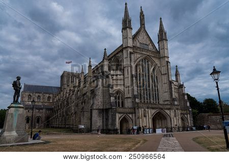 Winchester, England--july 17, 2018. The Front Of Winchester Cathedral  On A Cloudy Summer Afternoon.