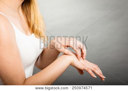 Dermatology, Allergy And Health Problem. Young Female Scratching Her Itchy Palm With Allergy Rash