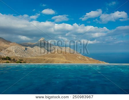 View From Pool At Mountaint And Blue Sky, Crete, Greece