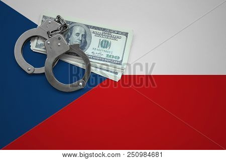 Czech Flag  With Handcuffs And A Bundle Of Dollars. The Concept Of Breaking The Law And Thieves Crim