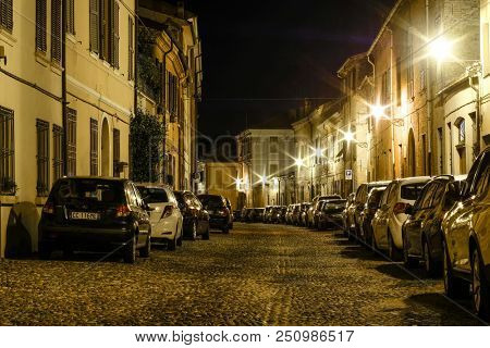 Ferrara, Italy - July, 23, 2018: cars parked in Ferrara, Italy, at night