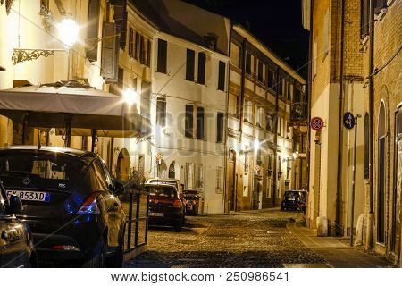 Ferrara, Italy - July, 23, 2018: cars parked in Ferrara, Italy, at night