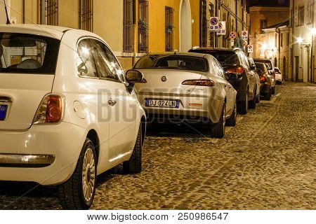 Ferrara, Italy - July, 23, 2018: cars parked in Ferrara, Italy, at night