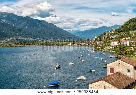 Landscape Of Lake Maggiore With Mountains And Magadino Village In The Background From Vira Gambarogn