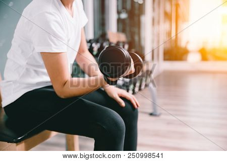 Closeup Slim Healthy Woman Lifting Dumbbell Personal Weight Training In Sport Club Casual Wear