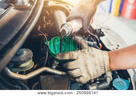 Car Maintenance Change Oil And Filling Engine Lube Liquid