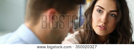 Portrait Of Thoughtful Manager Carefully Listening To Colleague. Co-workers Discussing New Start-up 