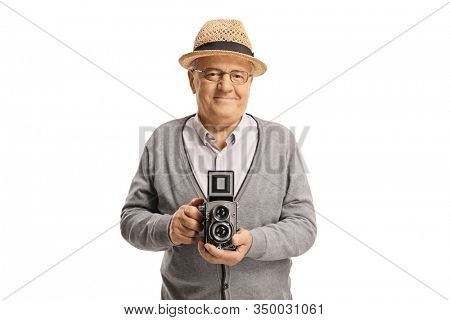 Elderly man holding an old-fashined vintage camera isolated on white background