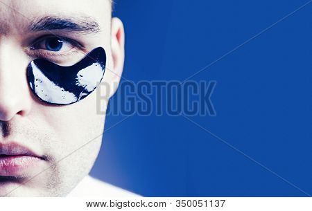 Man Face With Flakes Under The Eyes. Mans Flakes. Patches Under Close Eyes For Man. Close Up Portrai