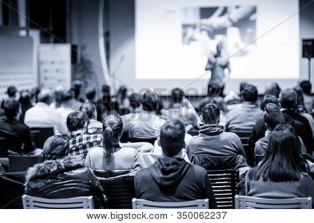 Male Public Peaker Giving Presentation On Business Conference Event.