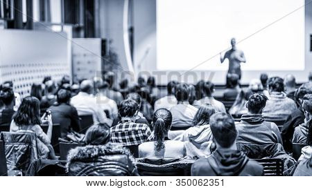 Male Public Peaker Giving Presentation On Business Conference Event.